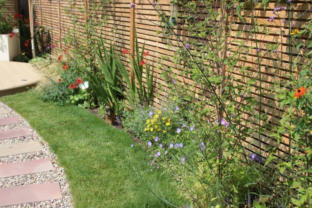 Border against a wooden fence
